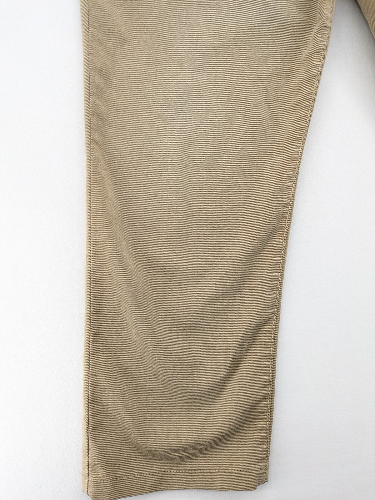 Joker beige straight jeans with double saddle stitching and classic 5-pocket design.
