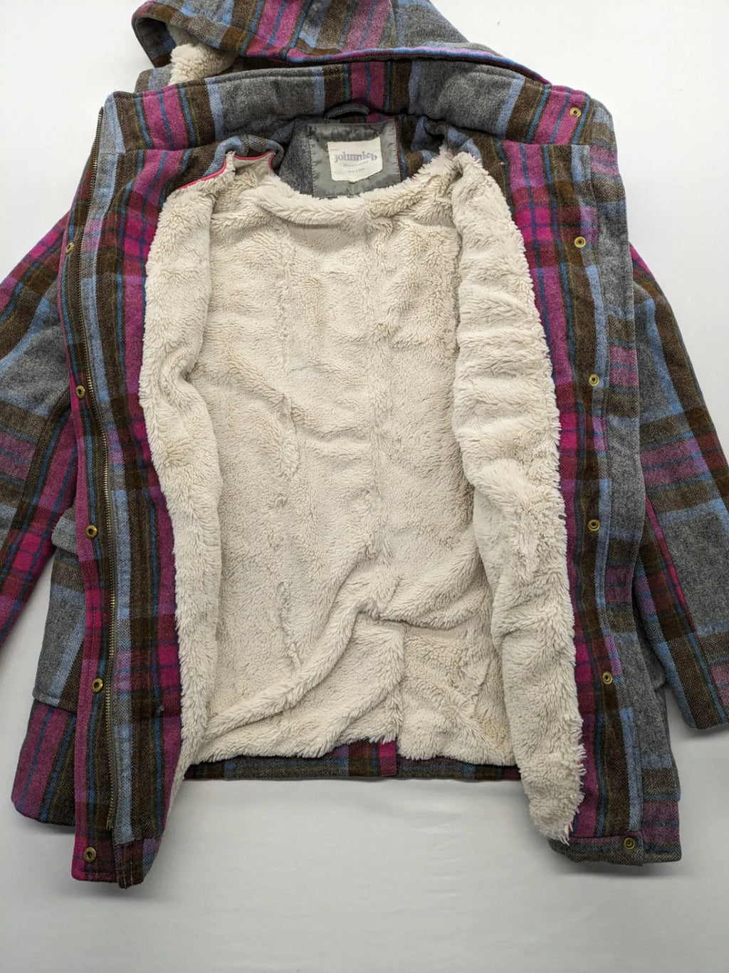 Johnnie B pink coat with gray check pattern, Sherpa lining, and zip closure.
