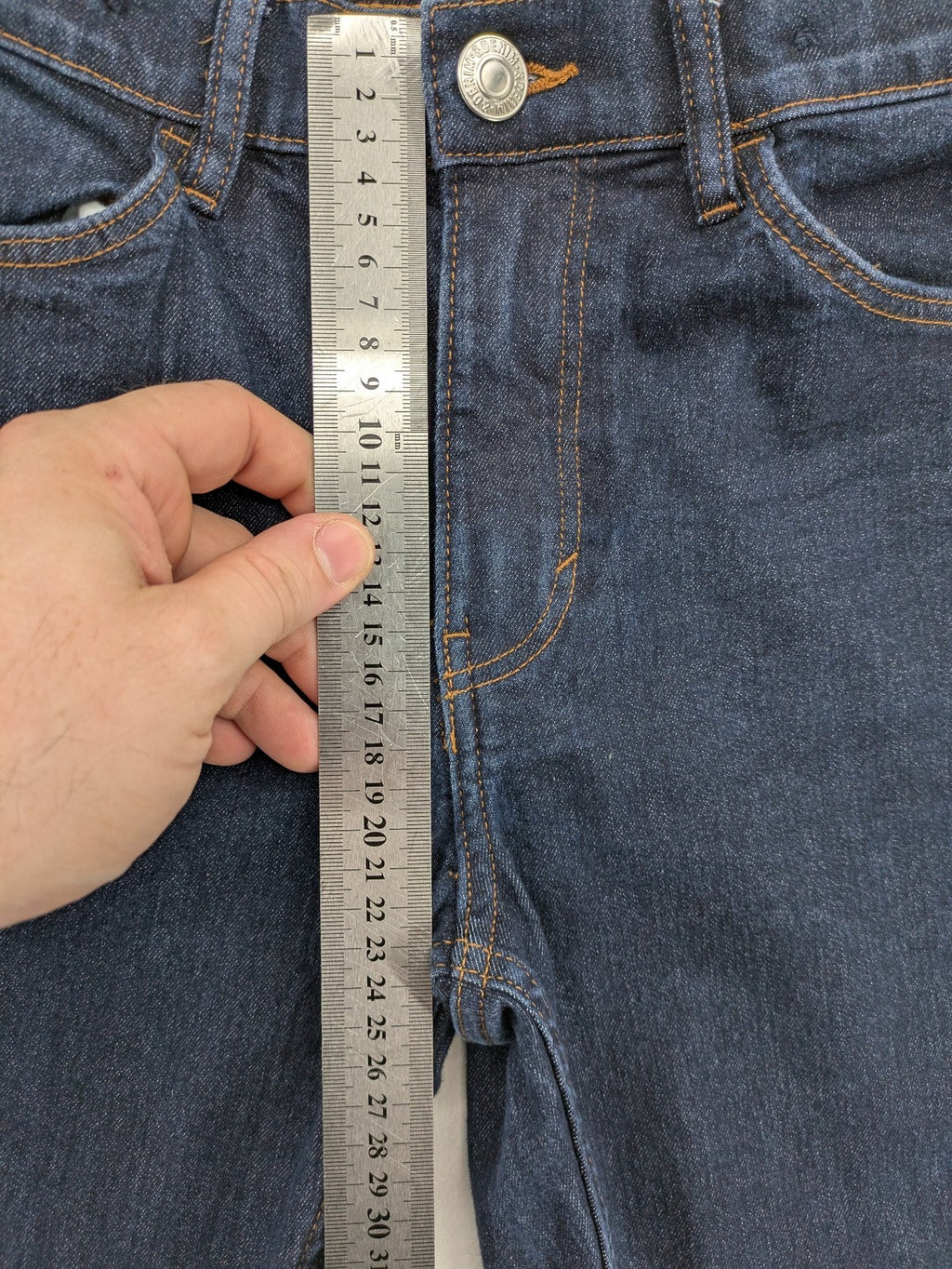 H&M blue skinny fit jeans with classic 5-pocket style and button closure.