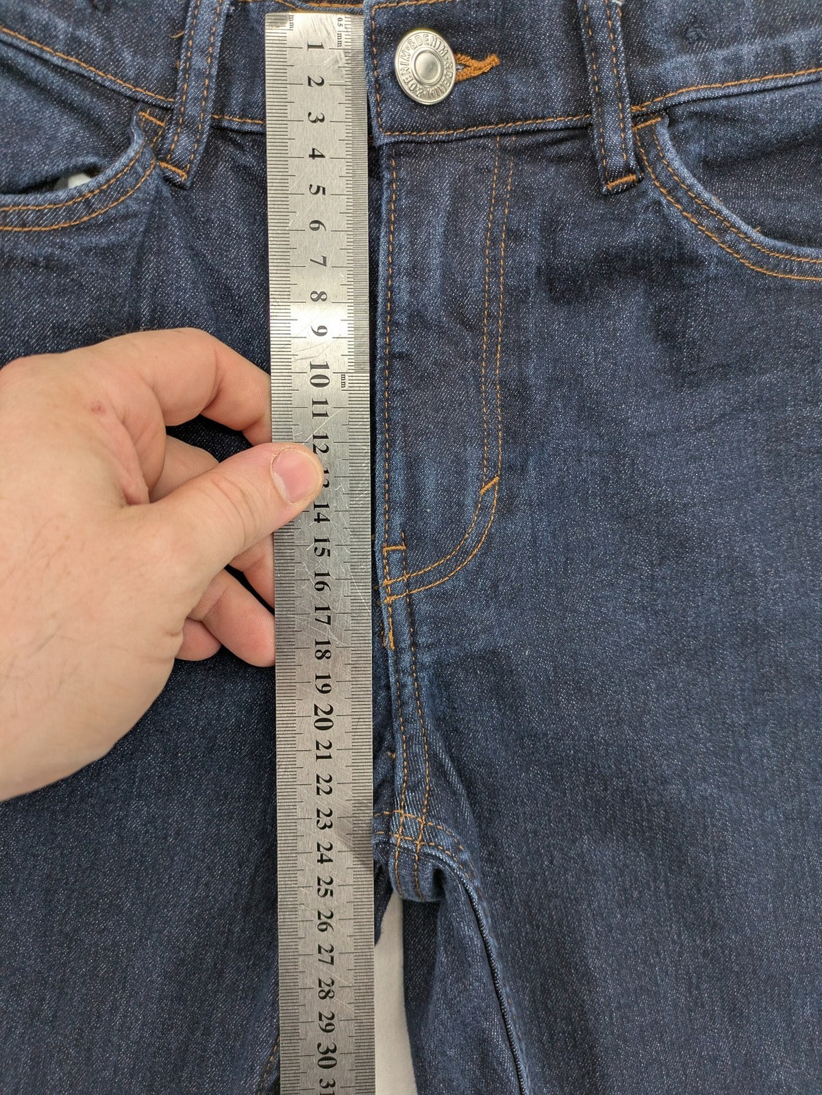 H&M blue skinny fit jeans with classic 5-pocket style and button closure.