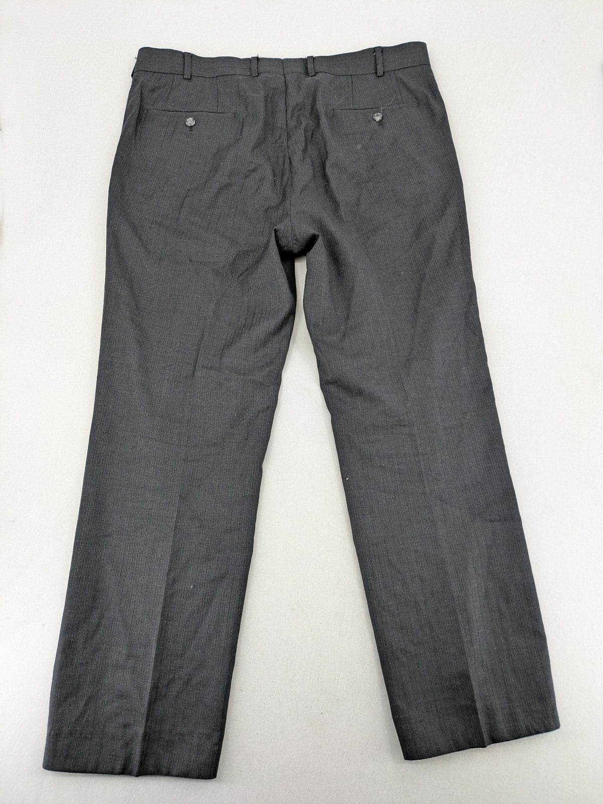 Desch grey suit pants with subtle pinstripe pattern and flat front design.