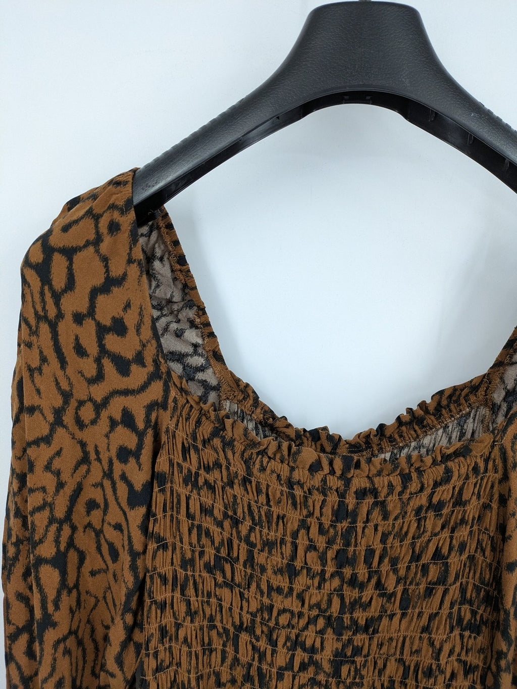 H&M brown and black animal print midi dress with smocked bodice and square neckline.