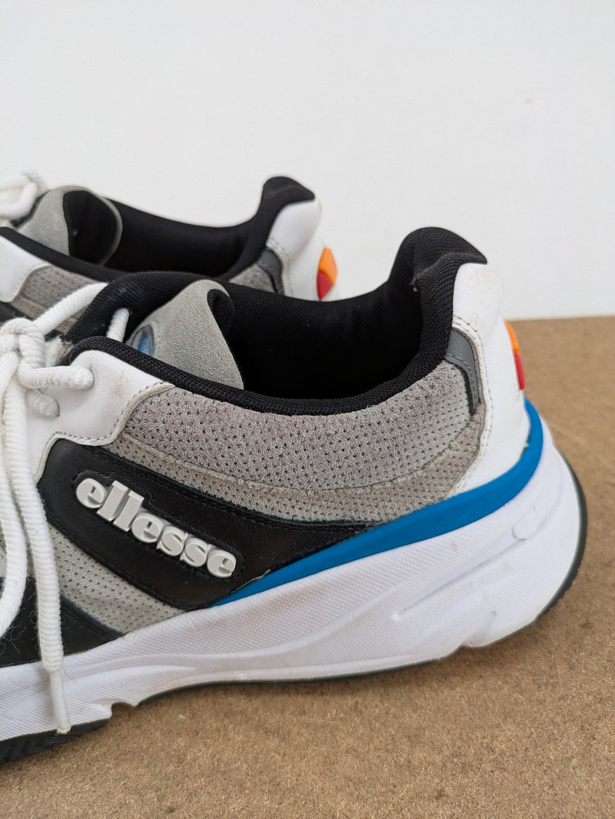 Ellesse Aurora chunky sneakers white grey with orange accents and multi-material upper.