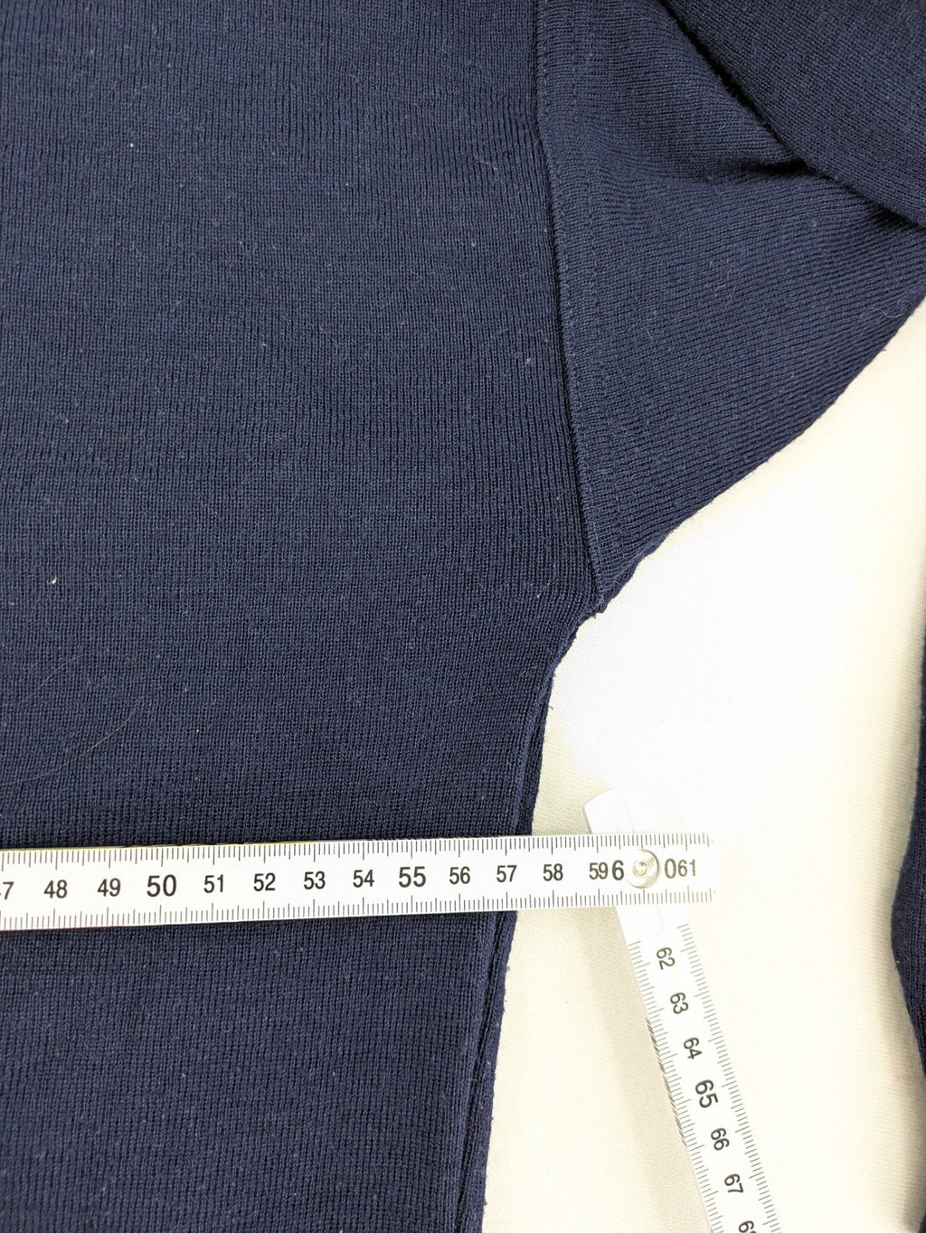 Schurwolle navy knit jumper classic V-neck with button placket, made from wool blend.