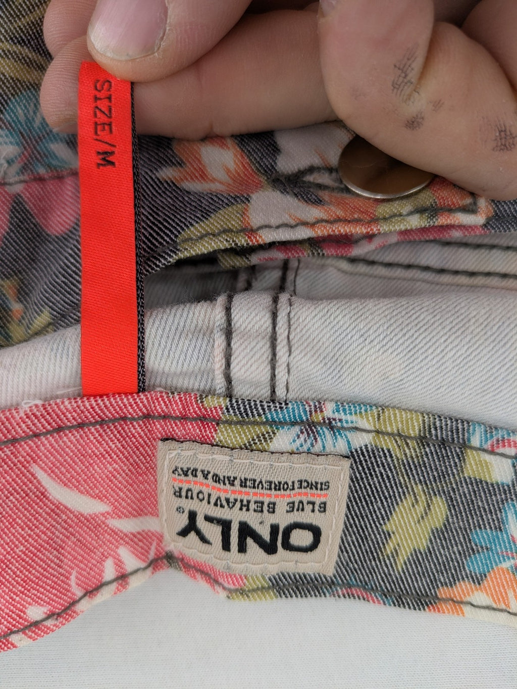 ONLY blue straight jeans with vibrant floral and paisley print on denim fabric.