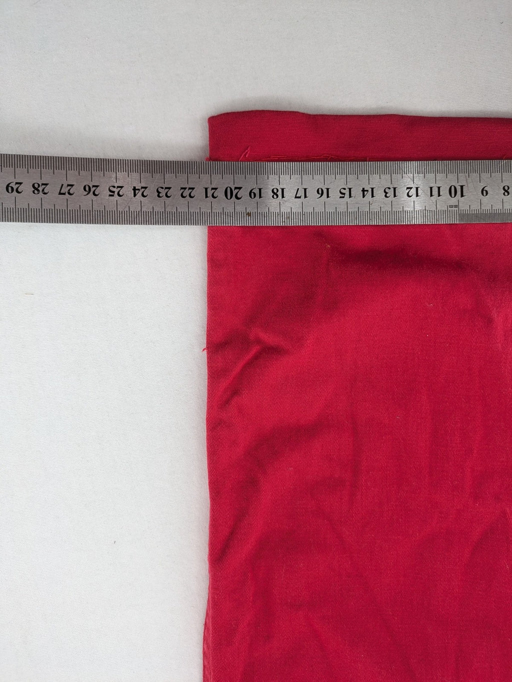 Jet Line red bootcut jeans with embroidered back pockets and pearl embellishments.