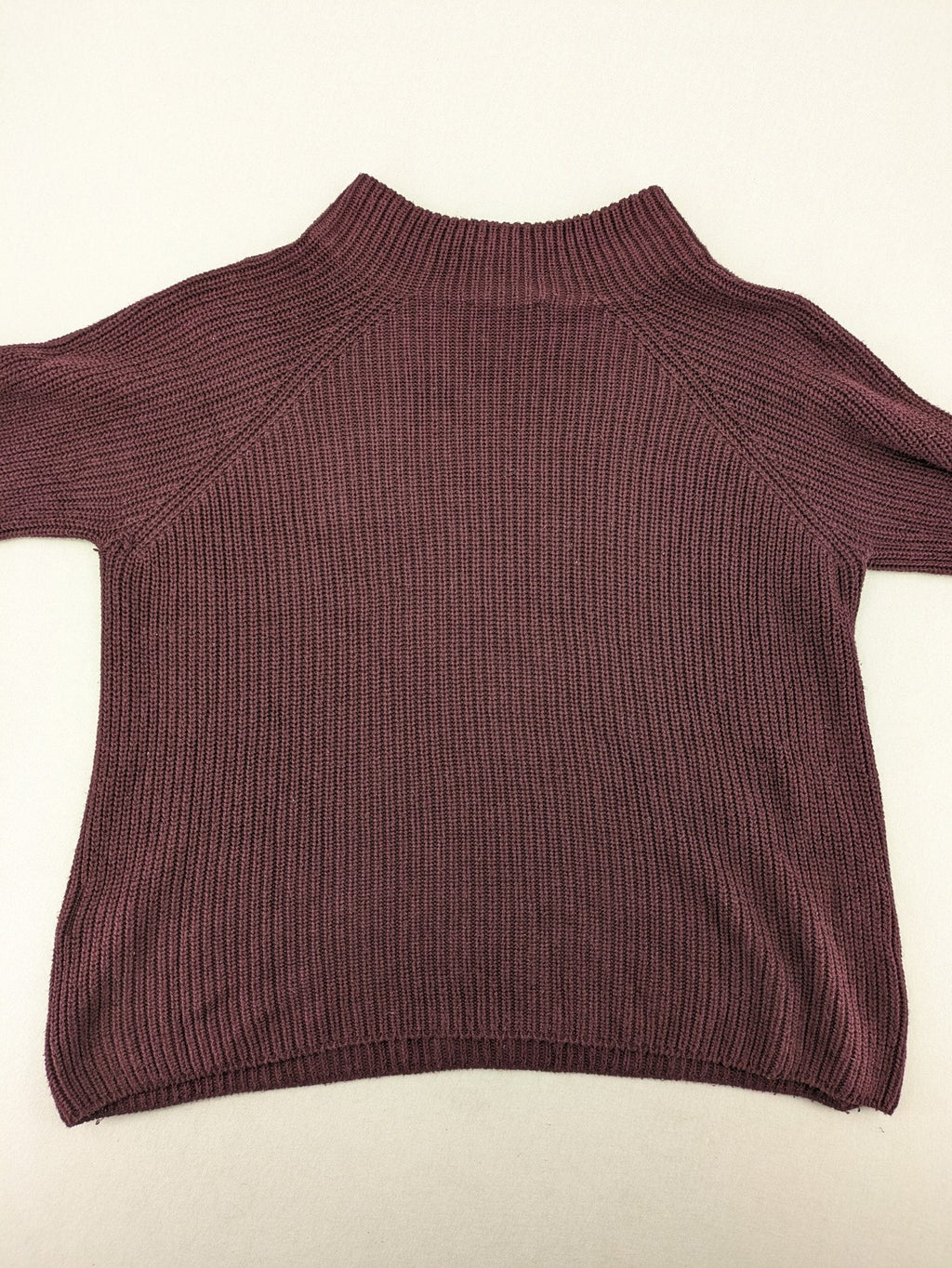 Monari burgundy knit jumper with standing collar, ribbed texture, and raglan sleeves.