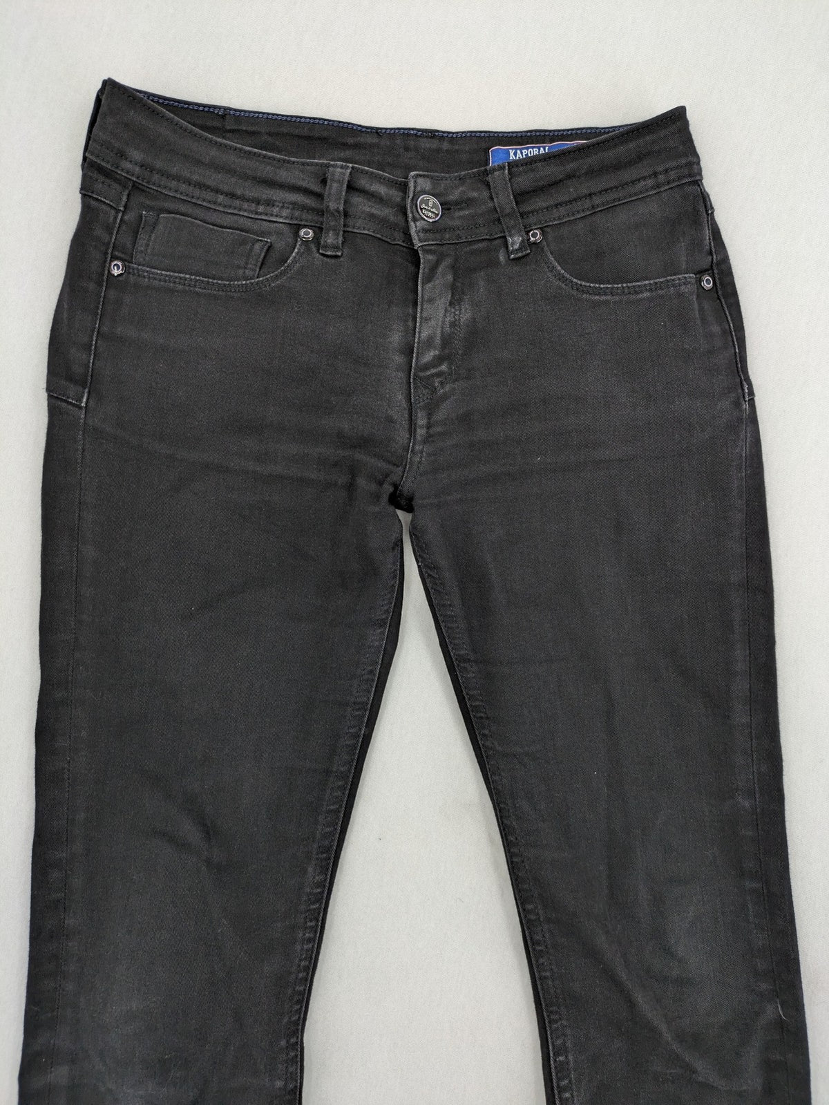 Kaporal black slim fit jeans with classic 5-pocket design and stretch denim material.