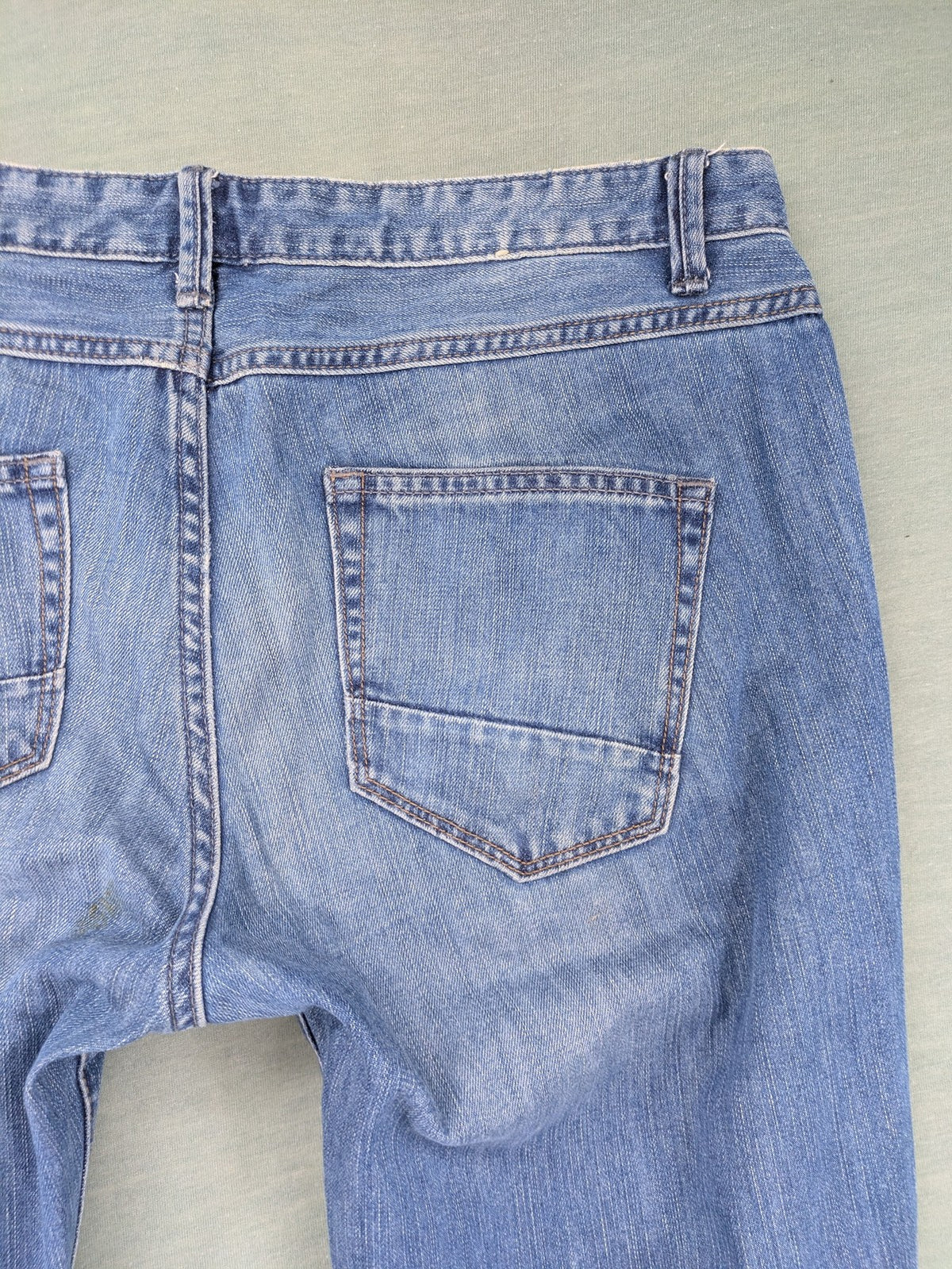 Benetton Jeans blue straight leg denim with button fly and classic design.