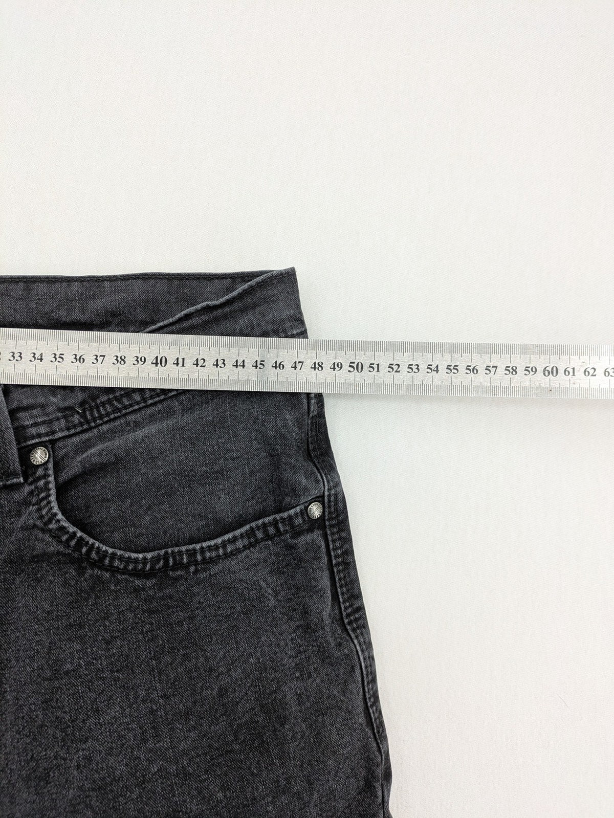 Pioneer grey straight jeans with washed finish and stretch material, classic design.