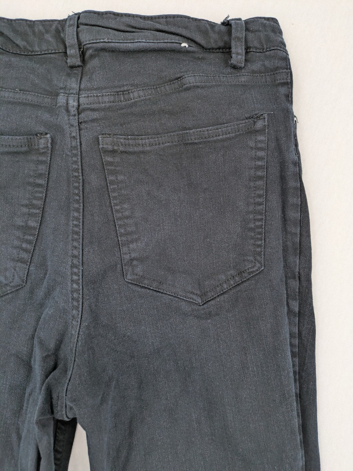 H&M grey skinny jeans with faded wash and soft stretch denim material.