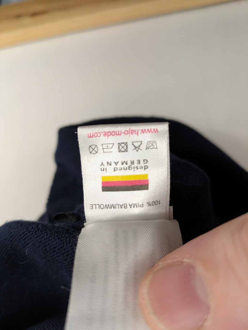 Hajo pink turtle neck jumper with embroidered logo and ribbed cuffs.