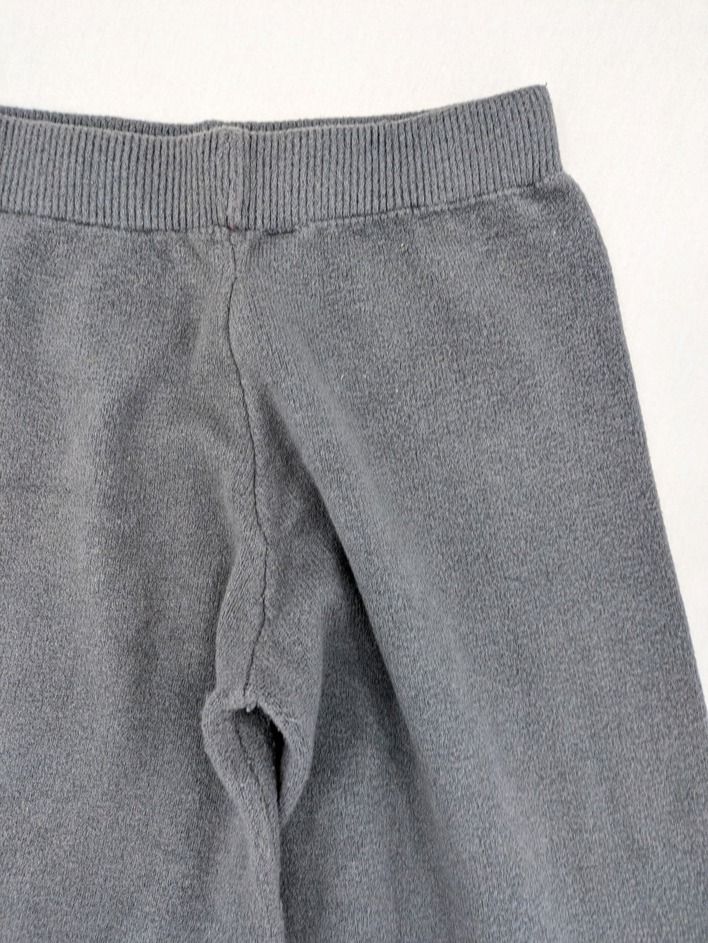 Grey pants with cable knit pattern, wide leg, ribbed waistband, 100% polyester.