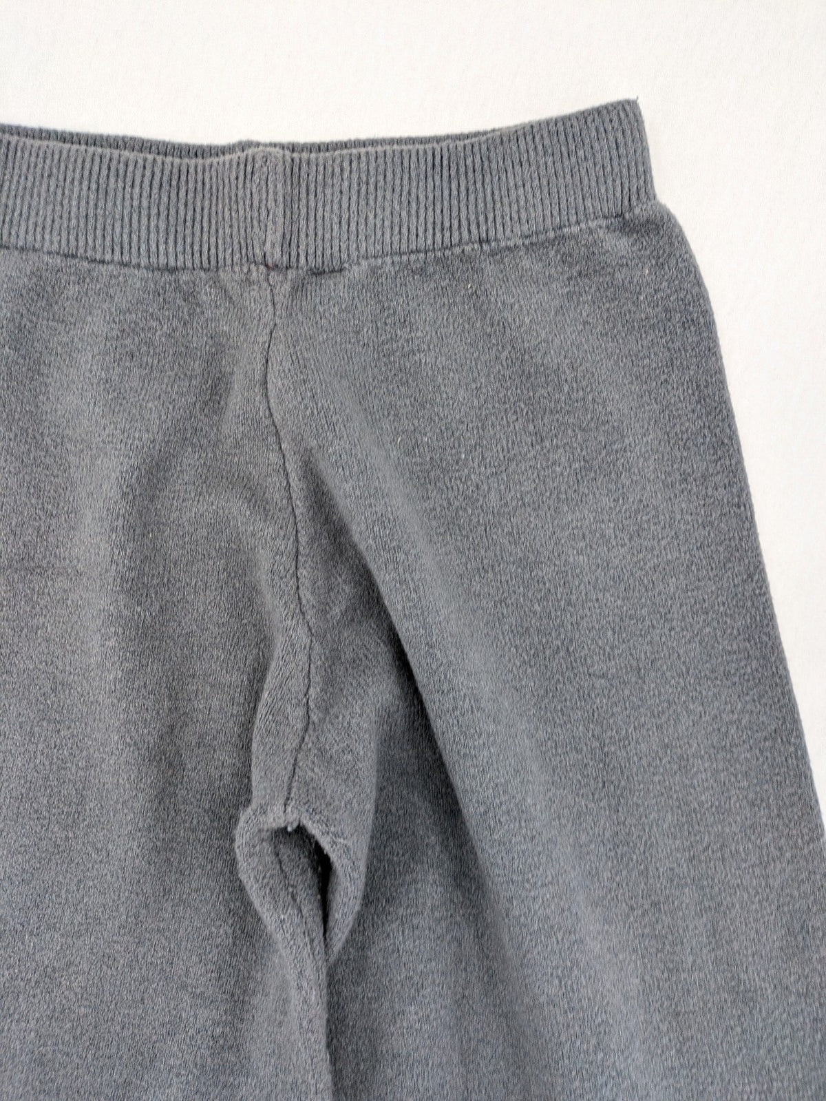 Grey pants with cable knit pattern, wide leg, ribbed waistband, 100% polyester.