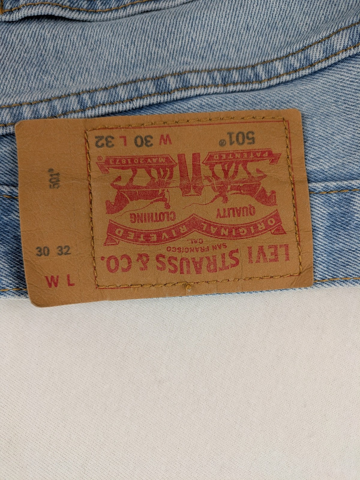 Levi's blue straight jeans light wash denim with button fly and classic fit.