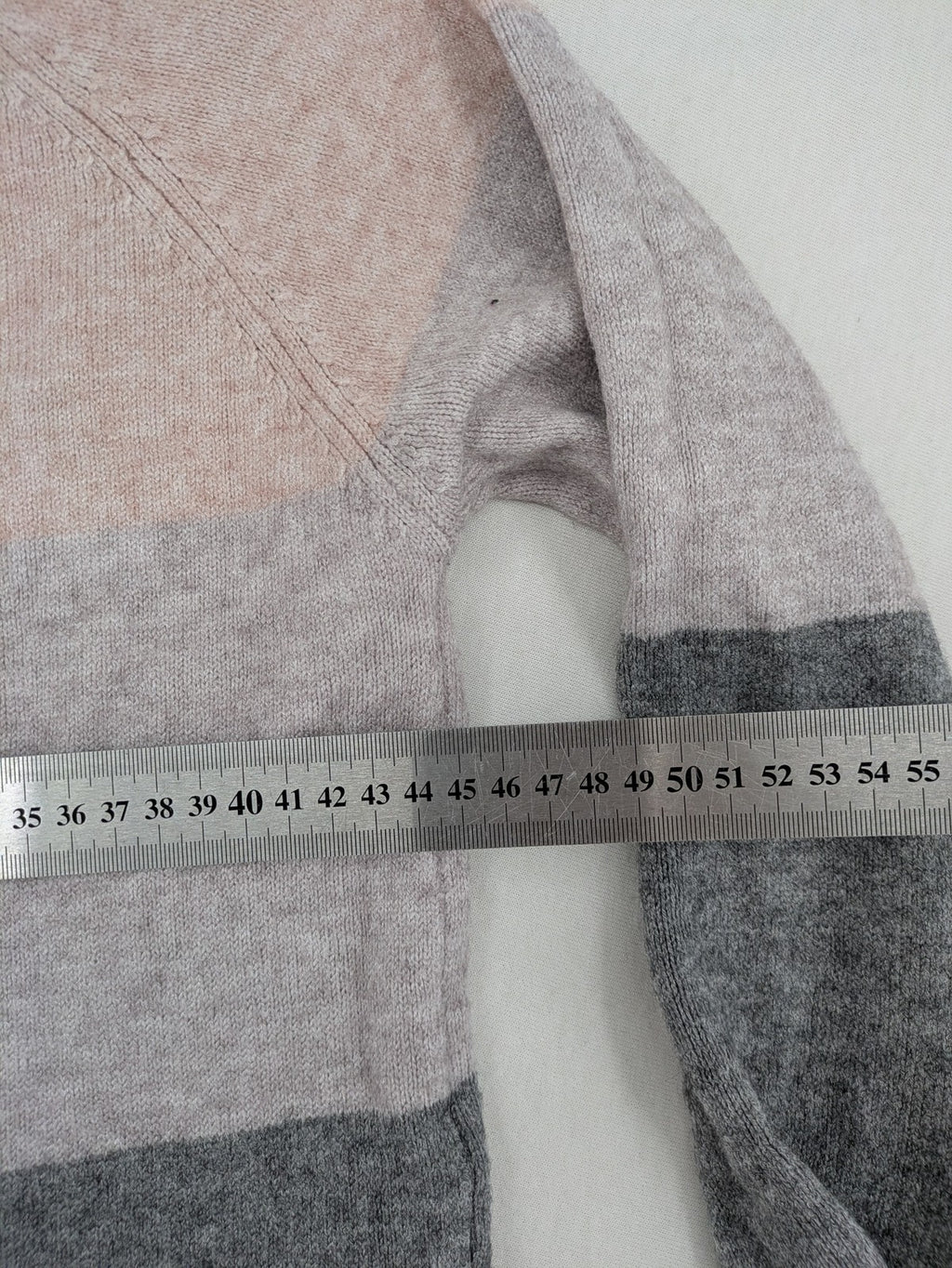 Only turtle neck jumper grey and orange colorblock design with long sleeves and round neckline.