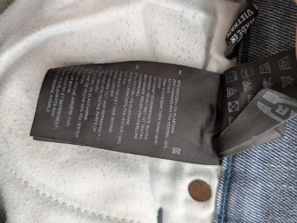 G-Star Raw grey denim straight jeans with classic button fly and subtle branding details.