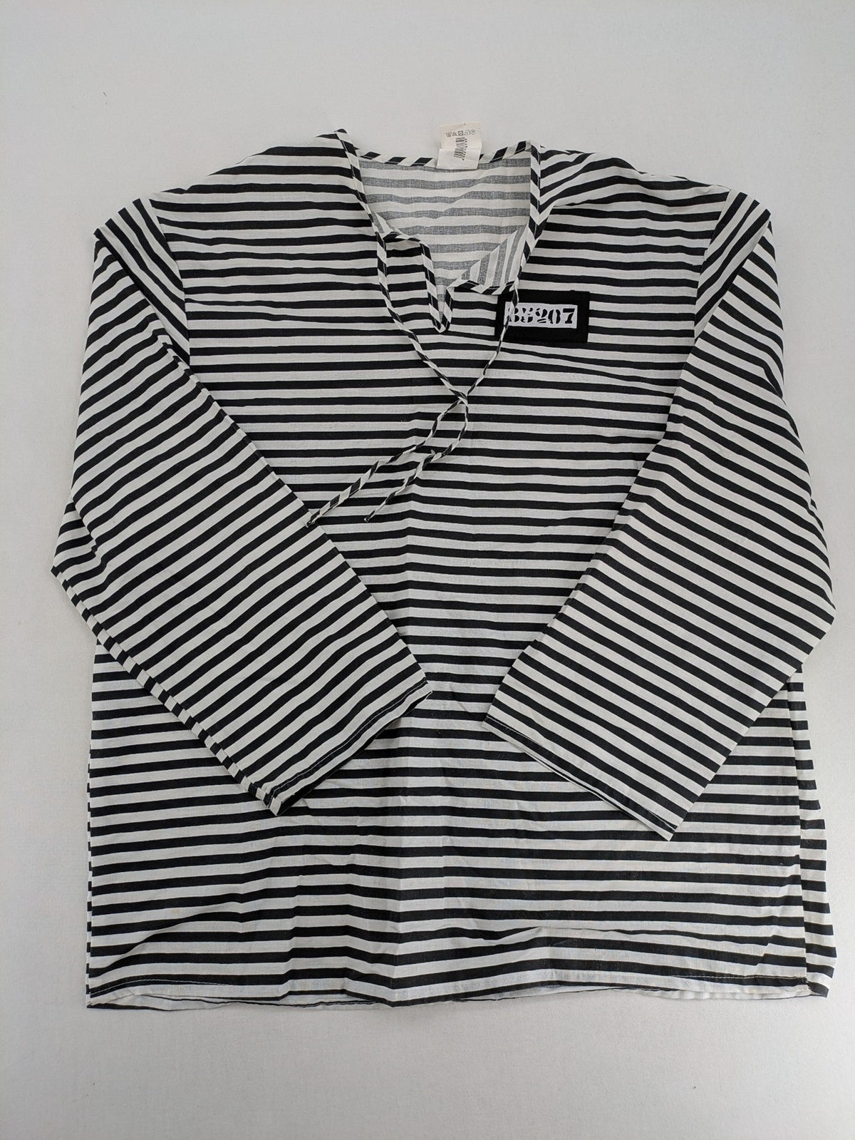 Rubie's costume set black and white striped with prisoner number patch on chest.