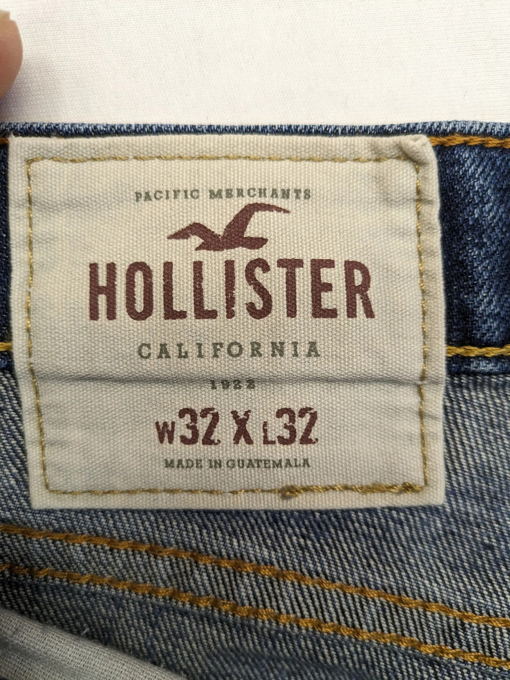 Hollister blue slim fit jeans with distressed detailing and classic button fly.