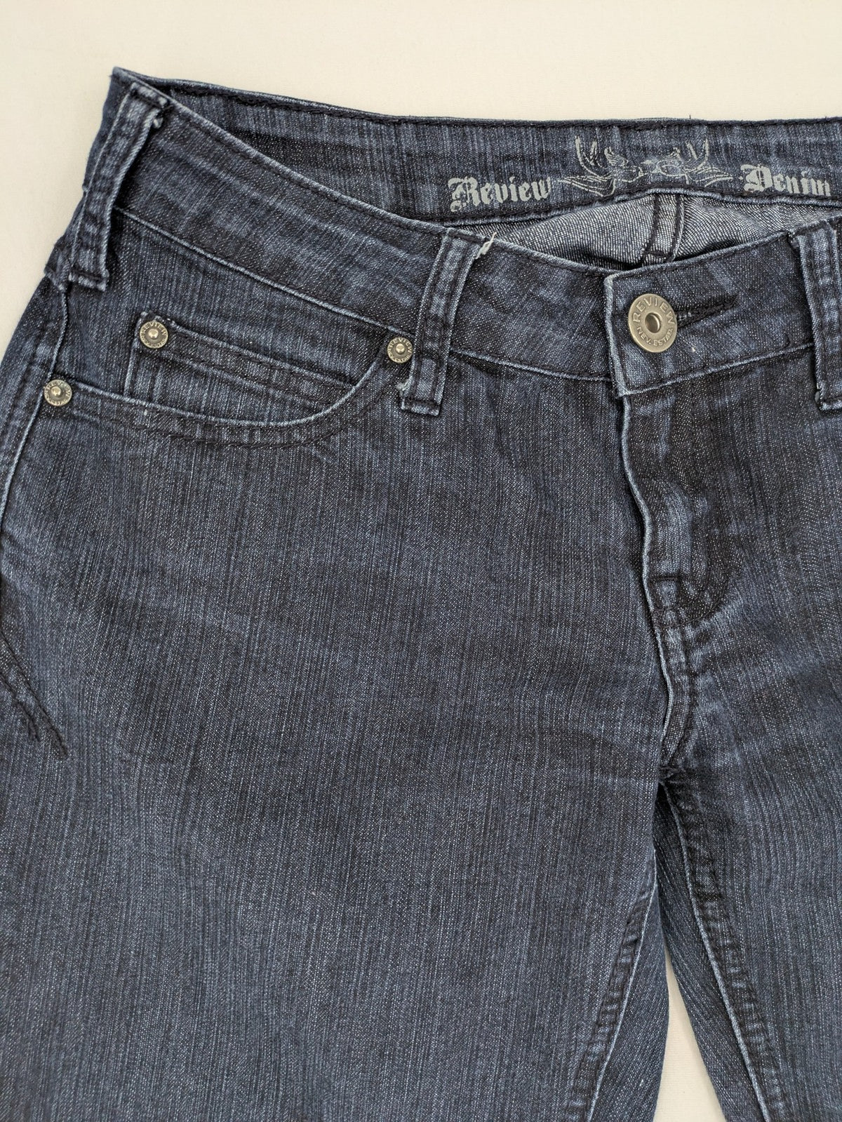 Review straight leg jeans dark blue low rise stretch denim with classic design.
