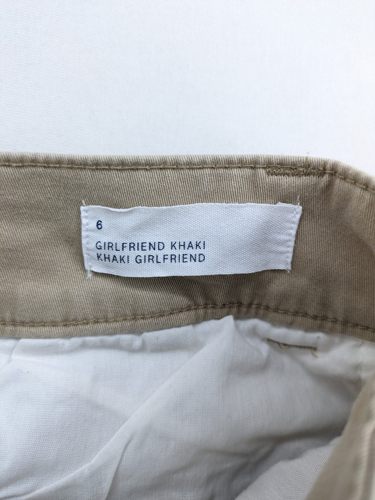 Gap beige girlfriend chino pants with relaxed fit and soft cotton-stretch blend.