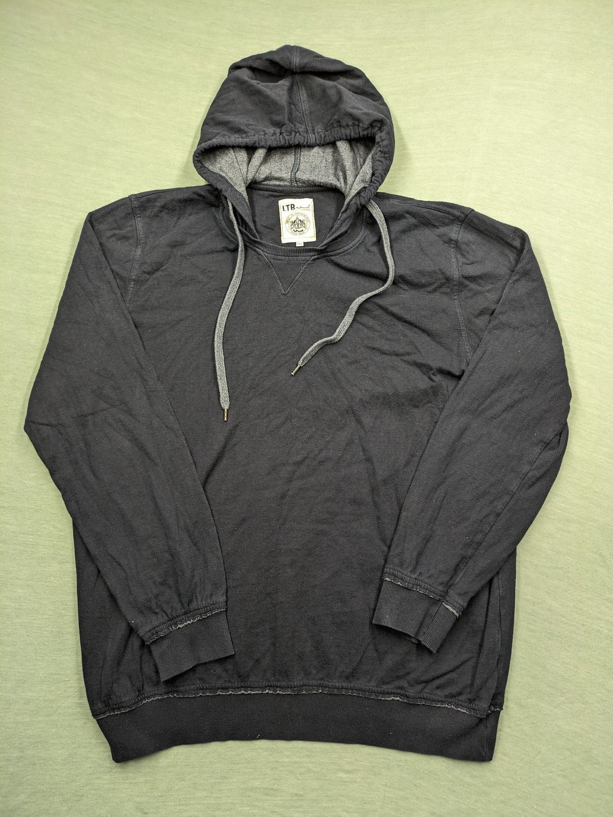 LTB black faded hoodie with adjustable drawstring and embroidered logo on sleeve.