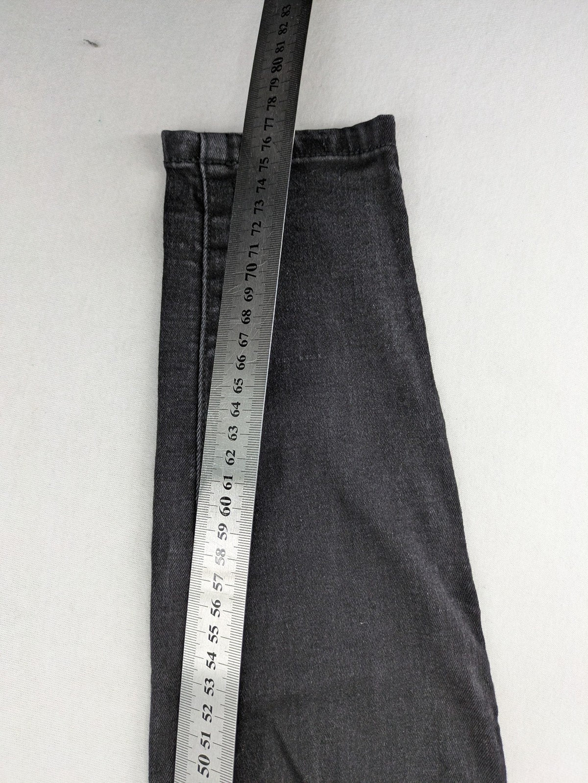 Denim & Co. black skinny jeans high waist stretch denim with washed finish.