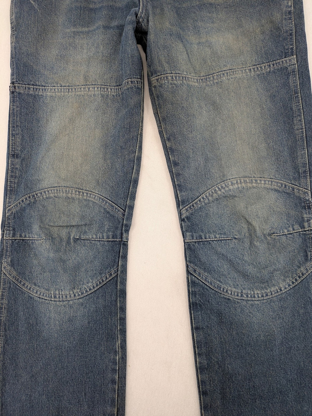 John F. Gee blue straight jeans with reinforced knees and durable denim material.