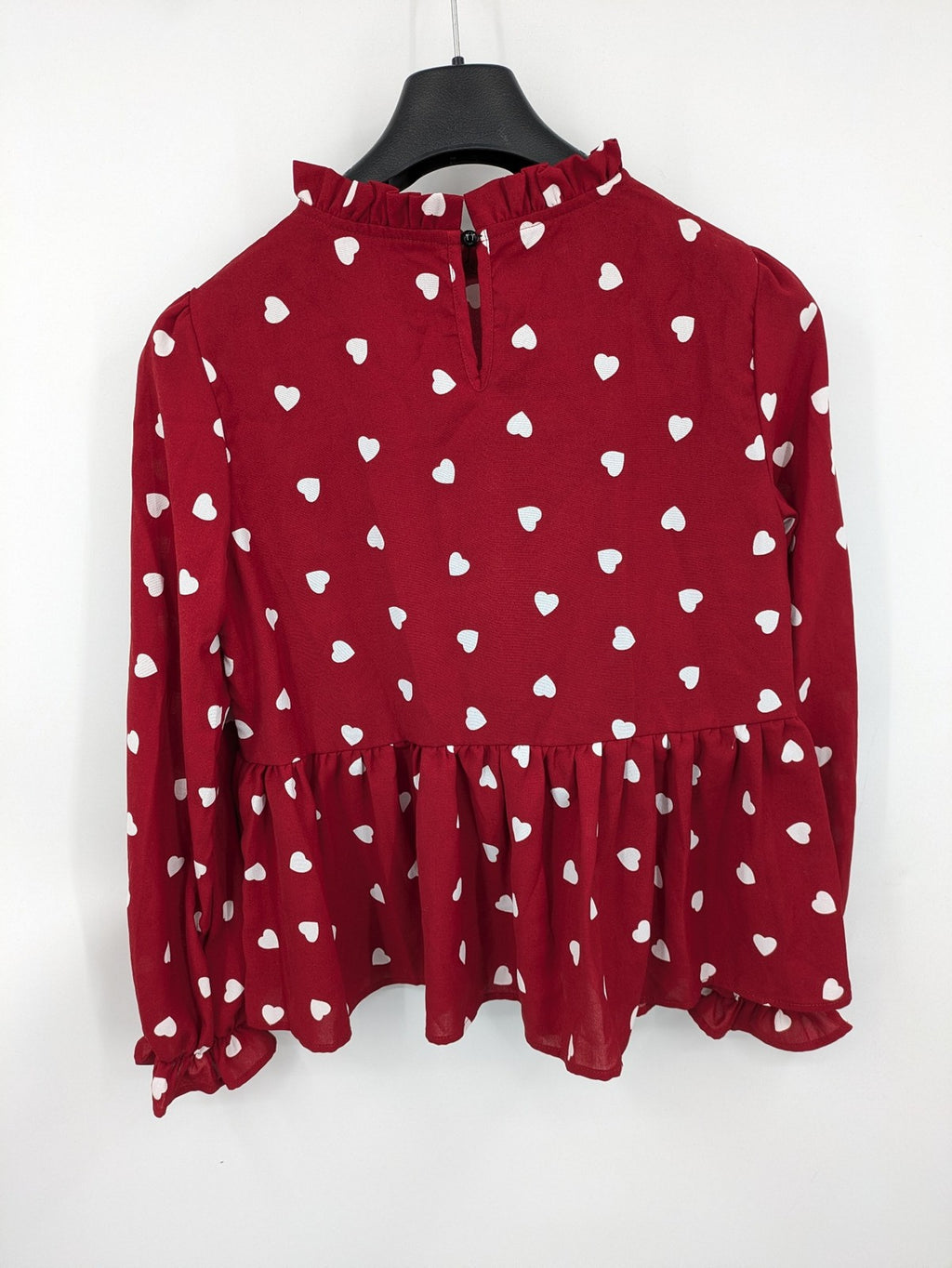SHEIN burgundy top with white heart pattern and ruffled neckline detail.