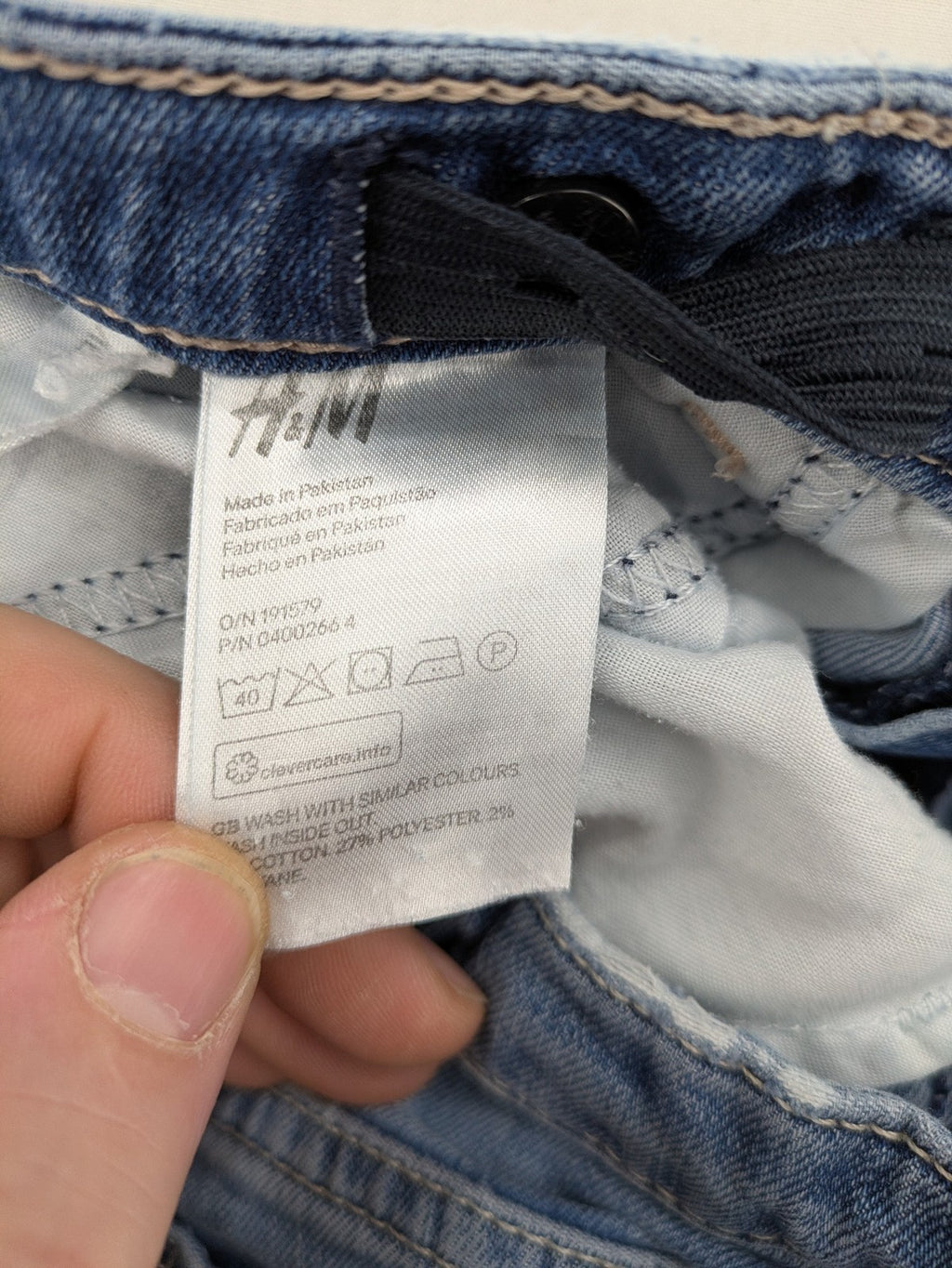 H&M blue bootcut jeans size 146, medium wash, stretch denim material.