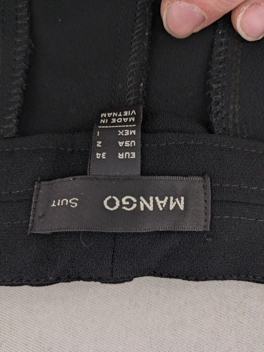 Mango Suit black trousers with zipper, belt loops, and front slant pockets.