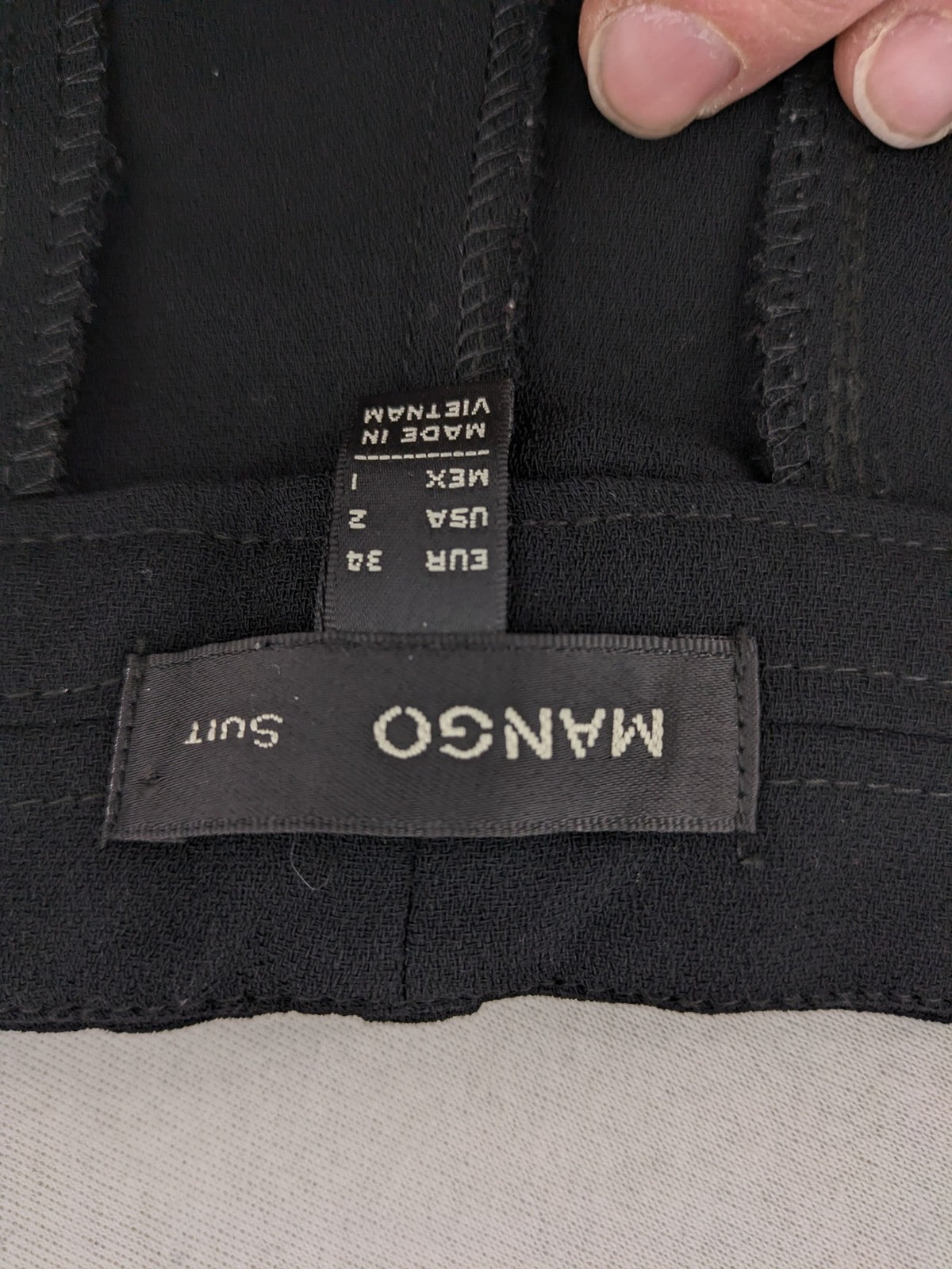 Mango Suit black trousers with zipper, belt loops, and front slant pockets.