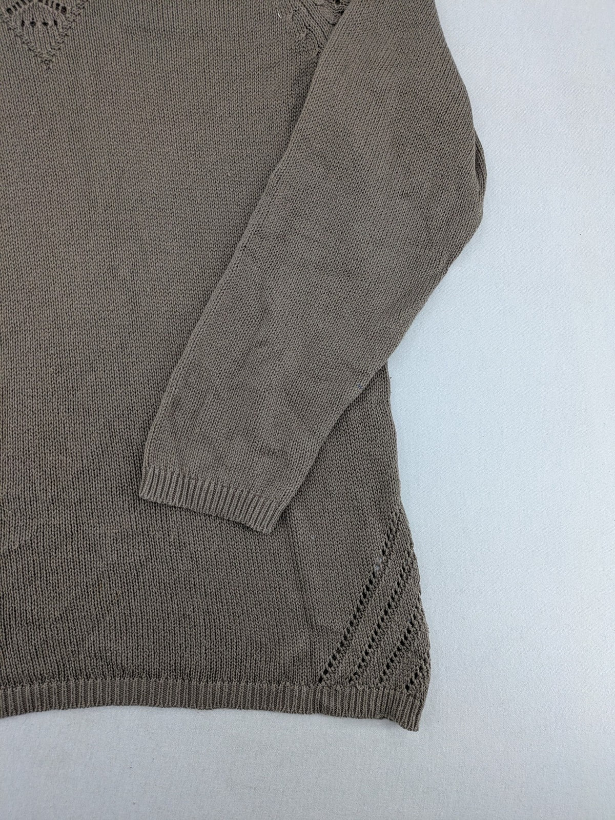 Dressin brown knit jumper with decorative open-knit details and comfortable fit.