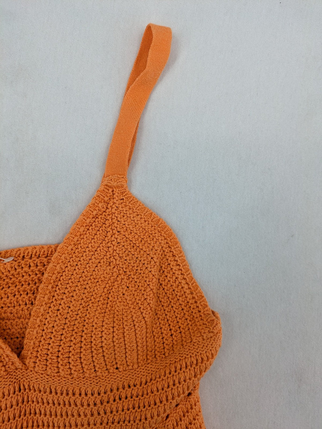 REVIEW orange crochet top with V-neck and peplum hem, made from 100% cotton.