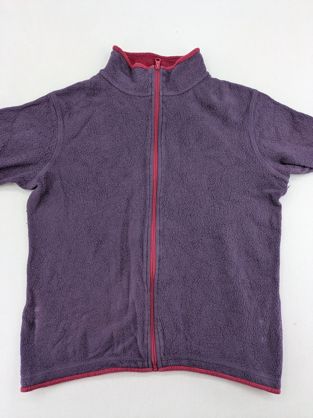 Waschbär pink and purple fleece jacket with red contrast details and high collar.