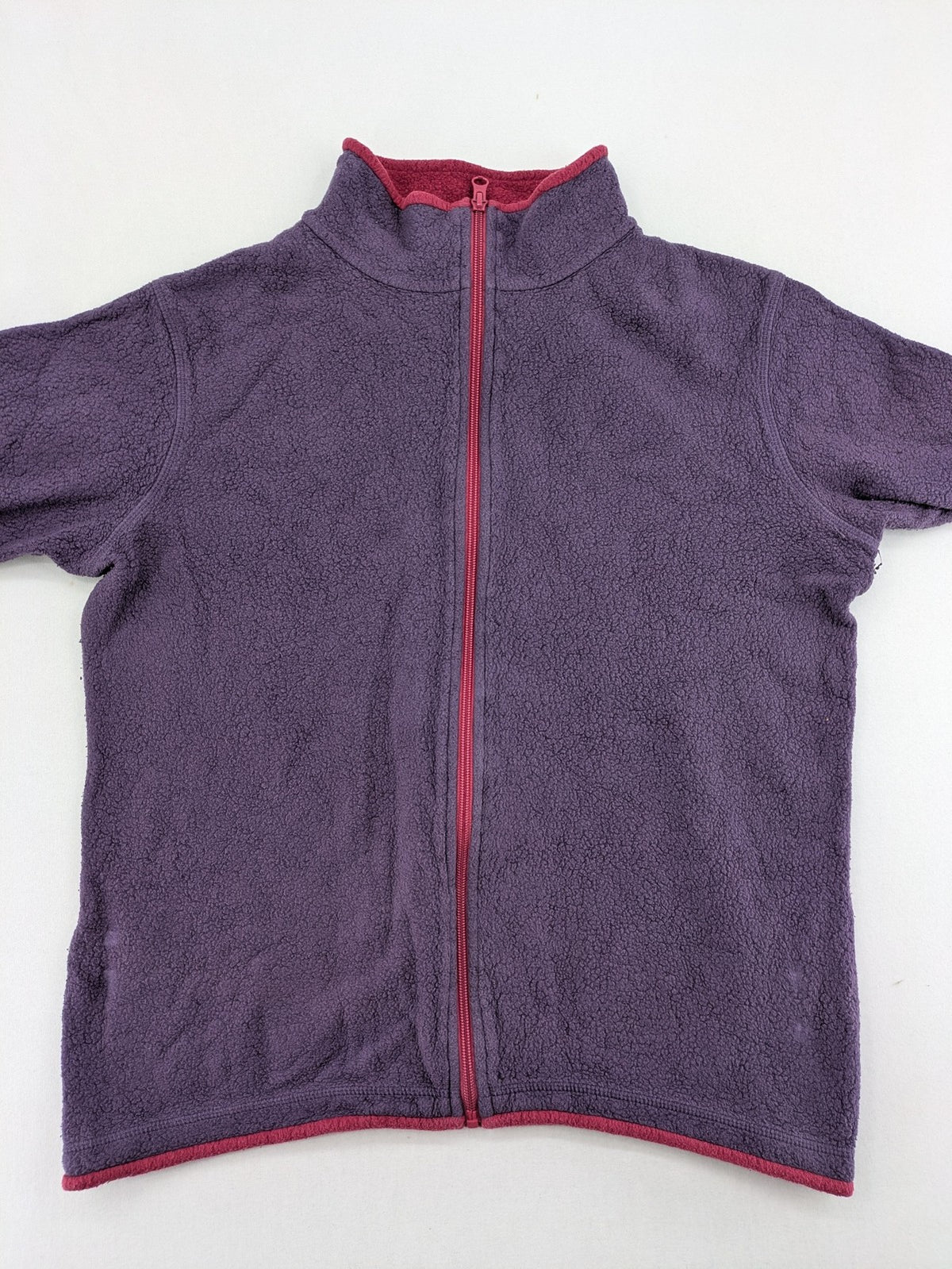 Waschbär pink and purple fleece jacket with red contrast details and high collar.