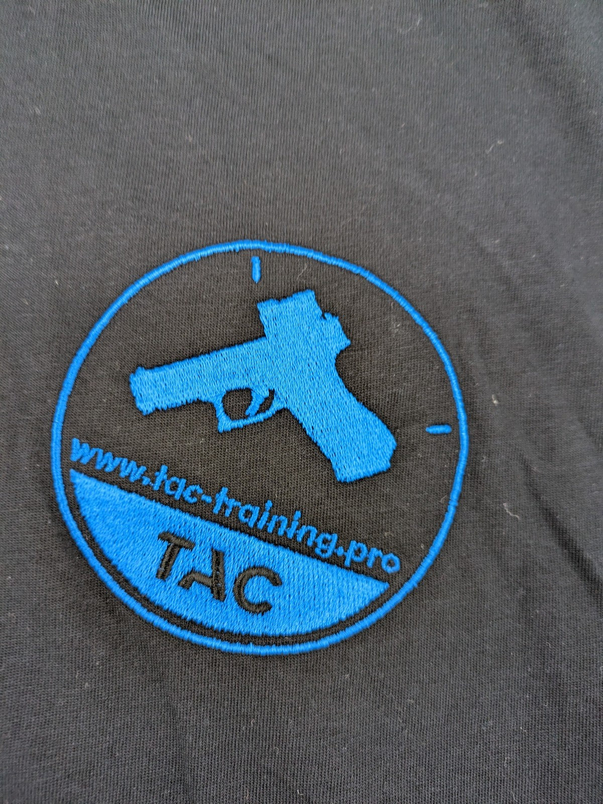 HAKRO blue and grey T-shirt with embroidered TAC Training logo on chest.