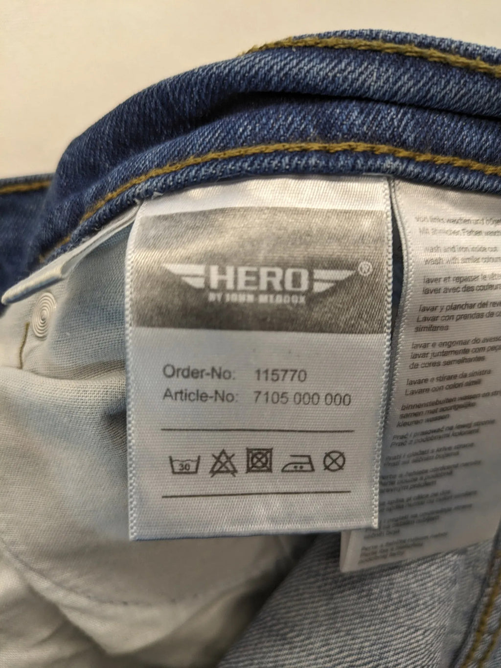 Hero By John Meddox blue straight jeans with five-pocket design and zip fly.
