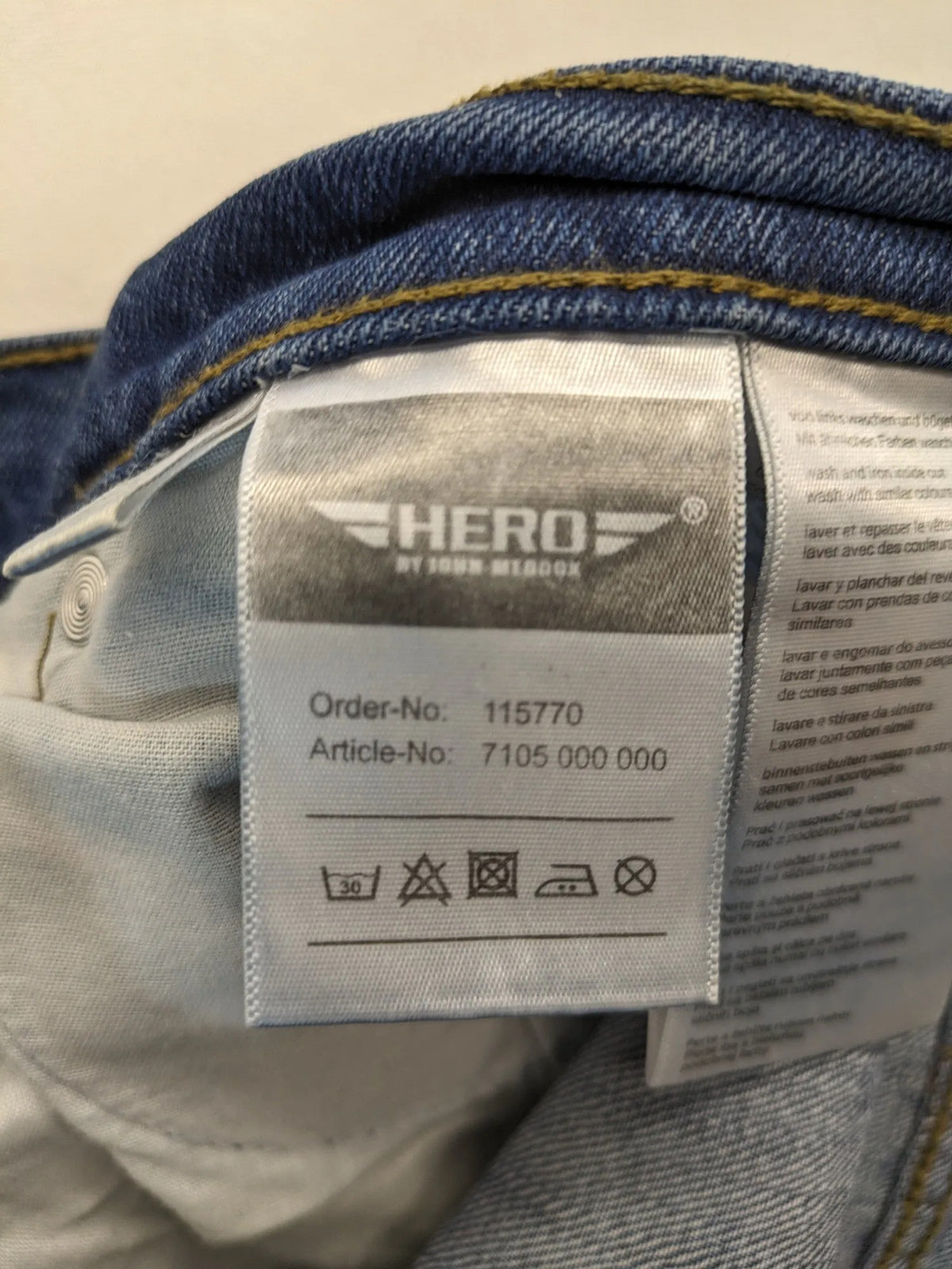 Hero By John Meddox blue straight jeans with five-pocket design and zip fly.