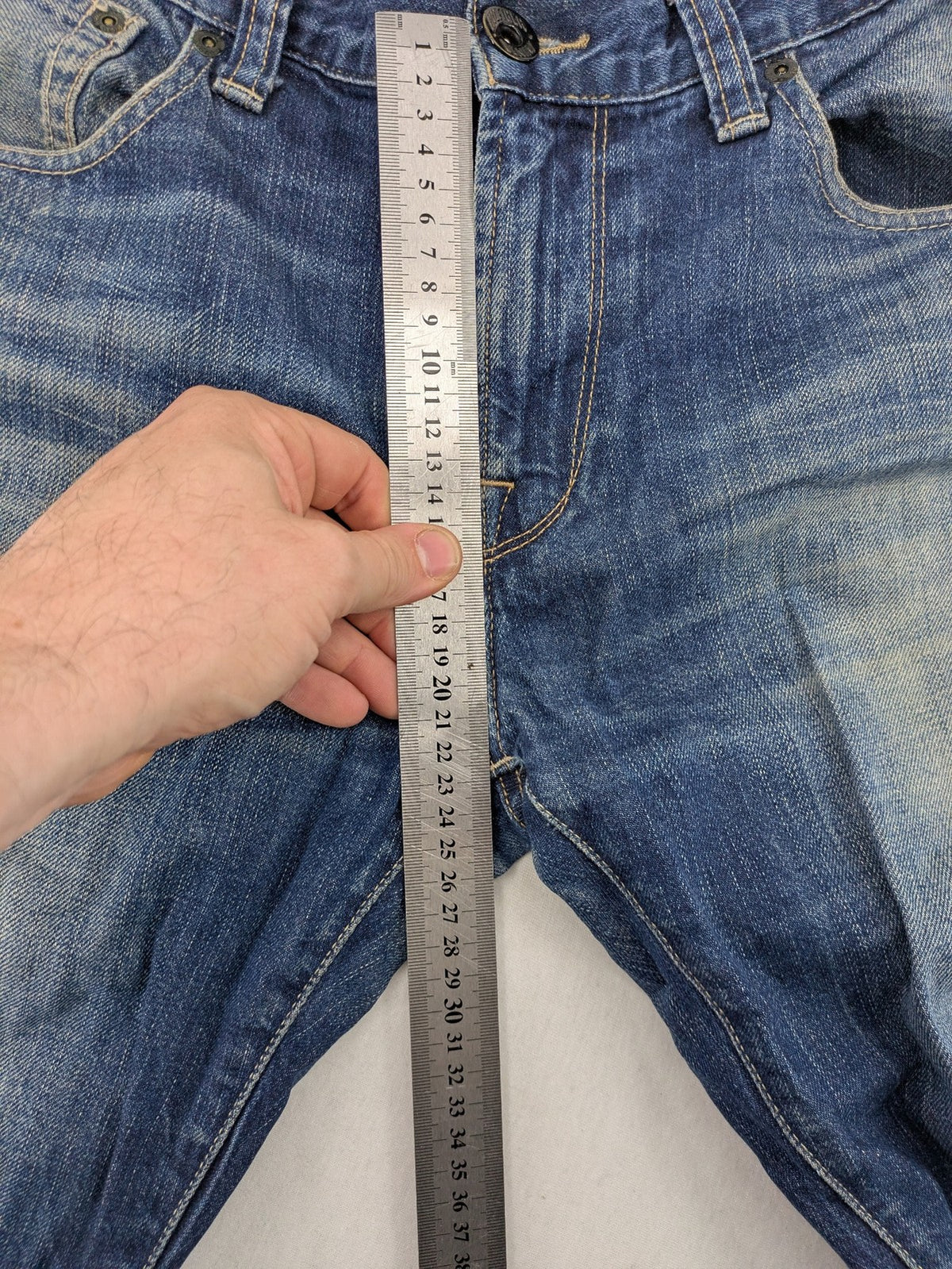 Hilfiger Denim blue straight jeans faded wash with Tommy Hilfiger flag logo on pocket.