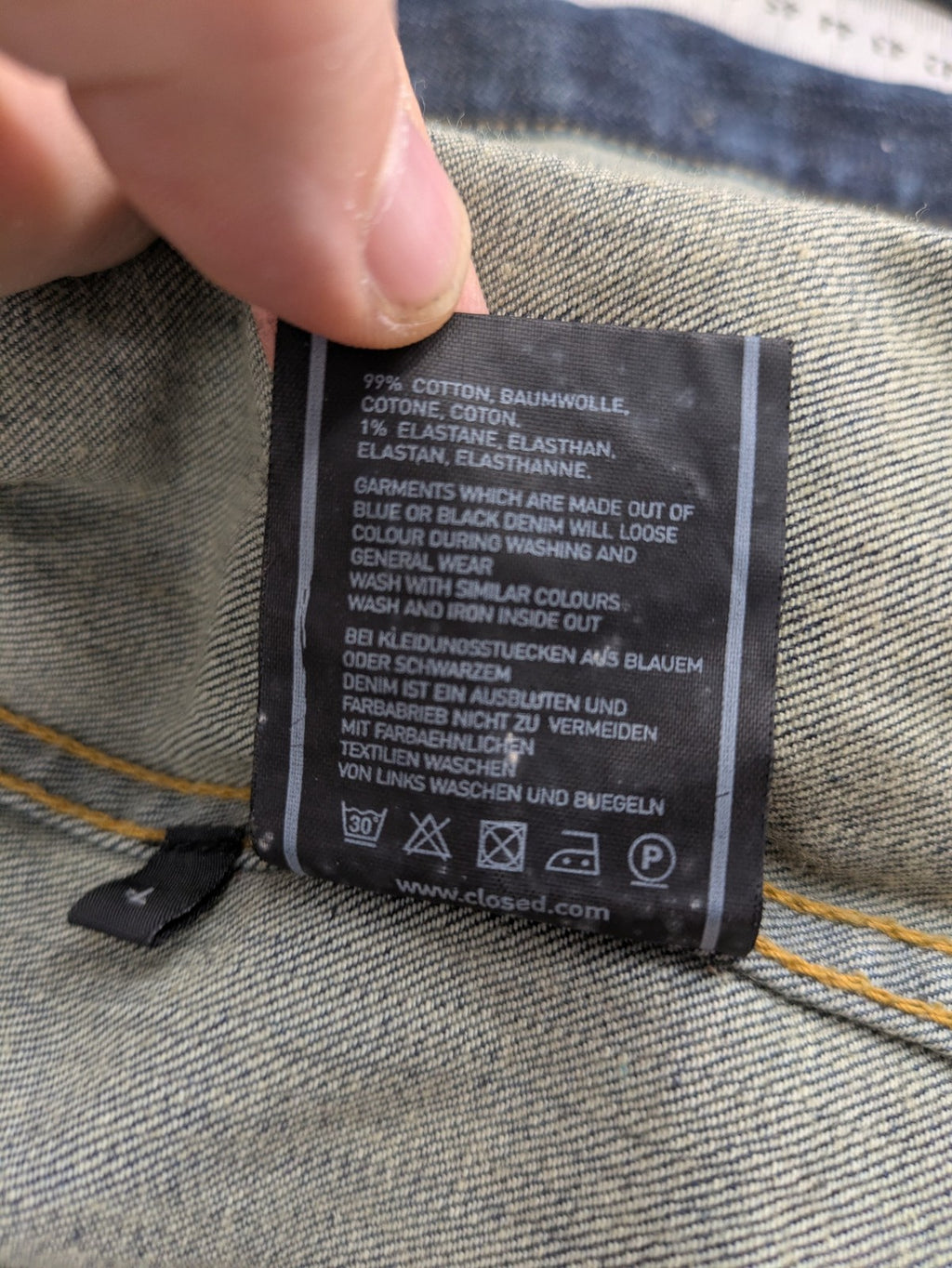 CLOSED blue denim trucker jacket with button front and two chest pockets.