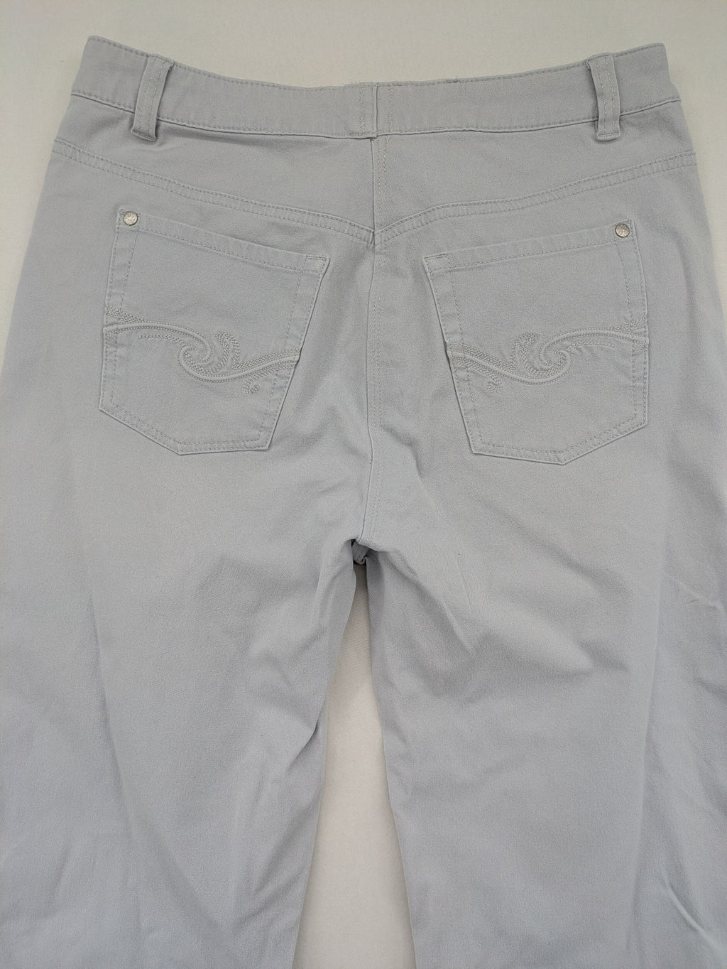 Chino grey capri pants five-pocket design with subtle embroidery and stretch cotton blend.