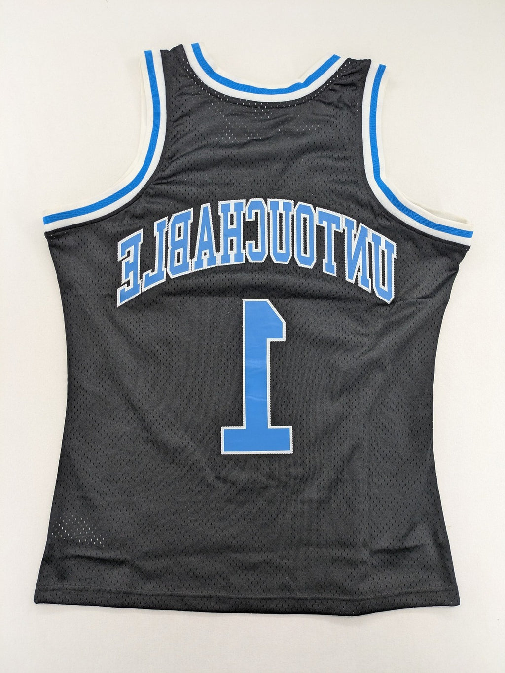 Friends With Money blue basketball jersey black mesh with stylized graphic and number "1