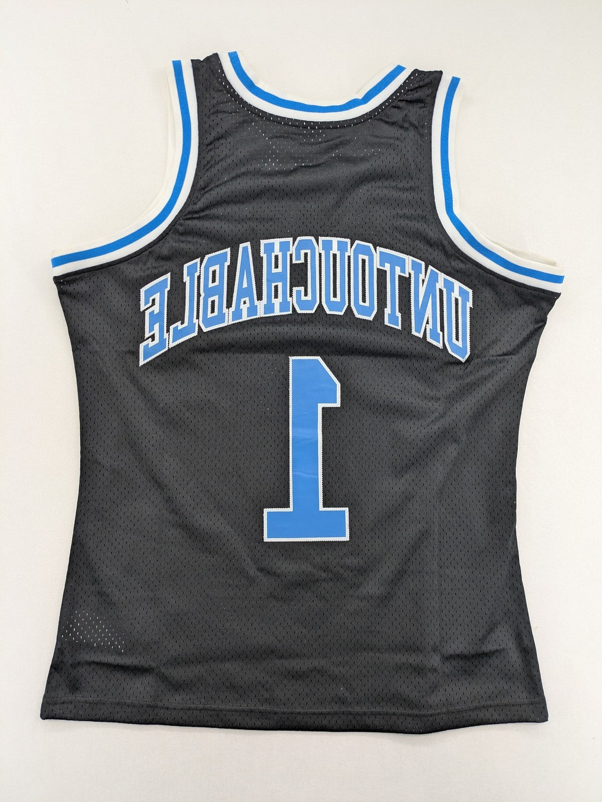 Friends With Money blue basketball jersey black mesh with stylized graphic and number "1