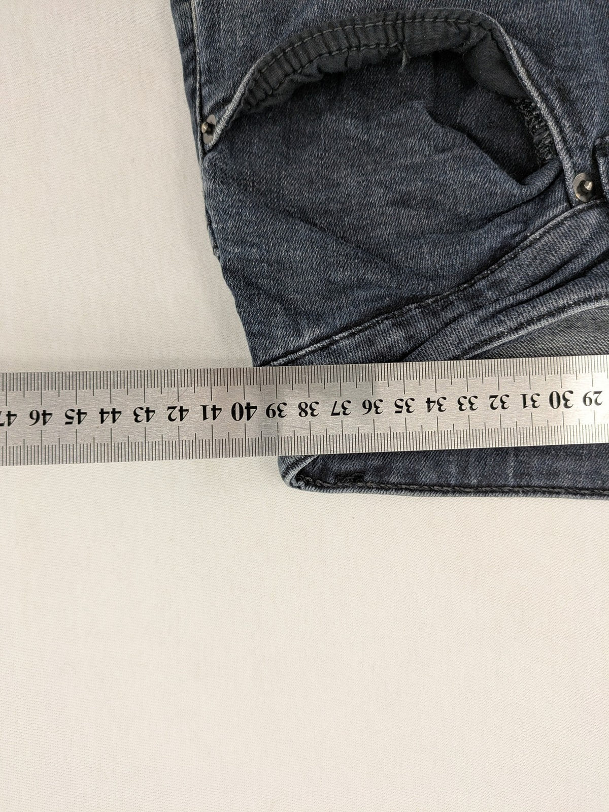 Zara blue slim fit jeans with classic 5-pocket design and subtle wash effect.