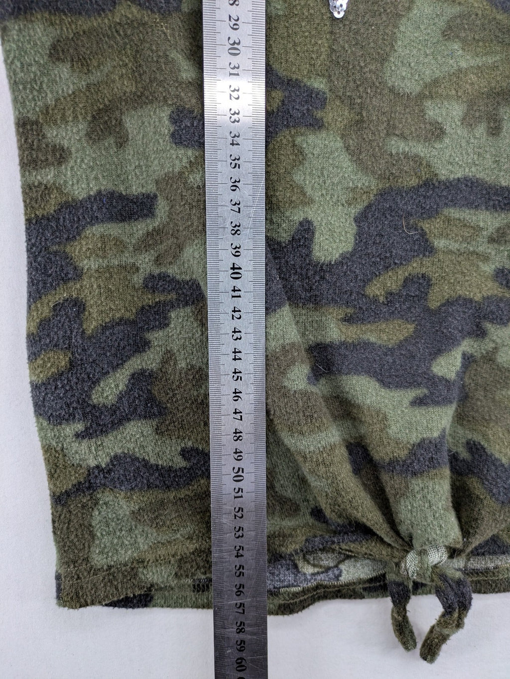 YFK turtle neck jumper multi camouflage print with sequined "COOL MOOD Today" graphic.