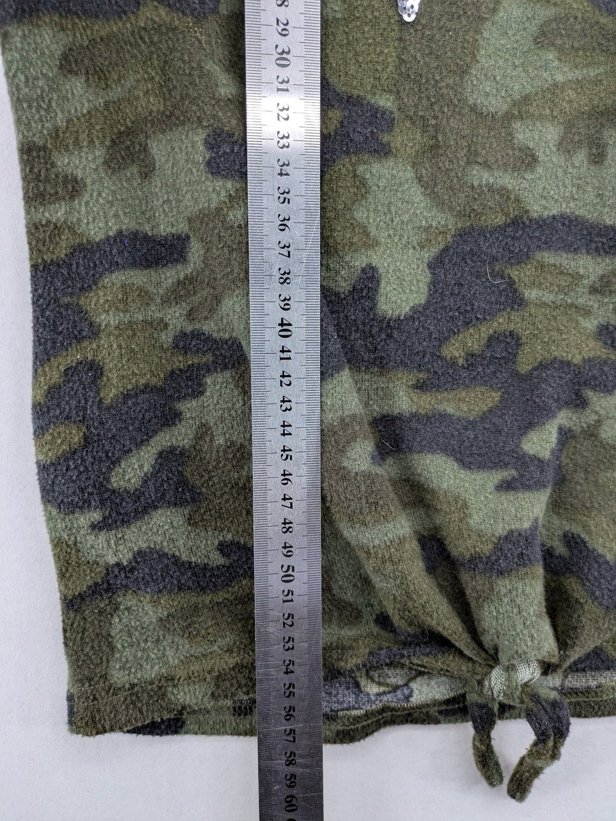 YFK turtle neck jumper multi camouflage print with sequined "COOL MOOD Today" graphic.