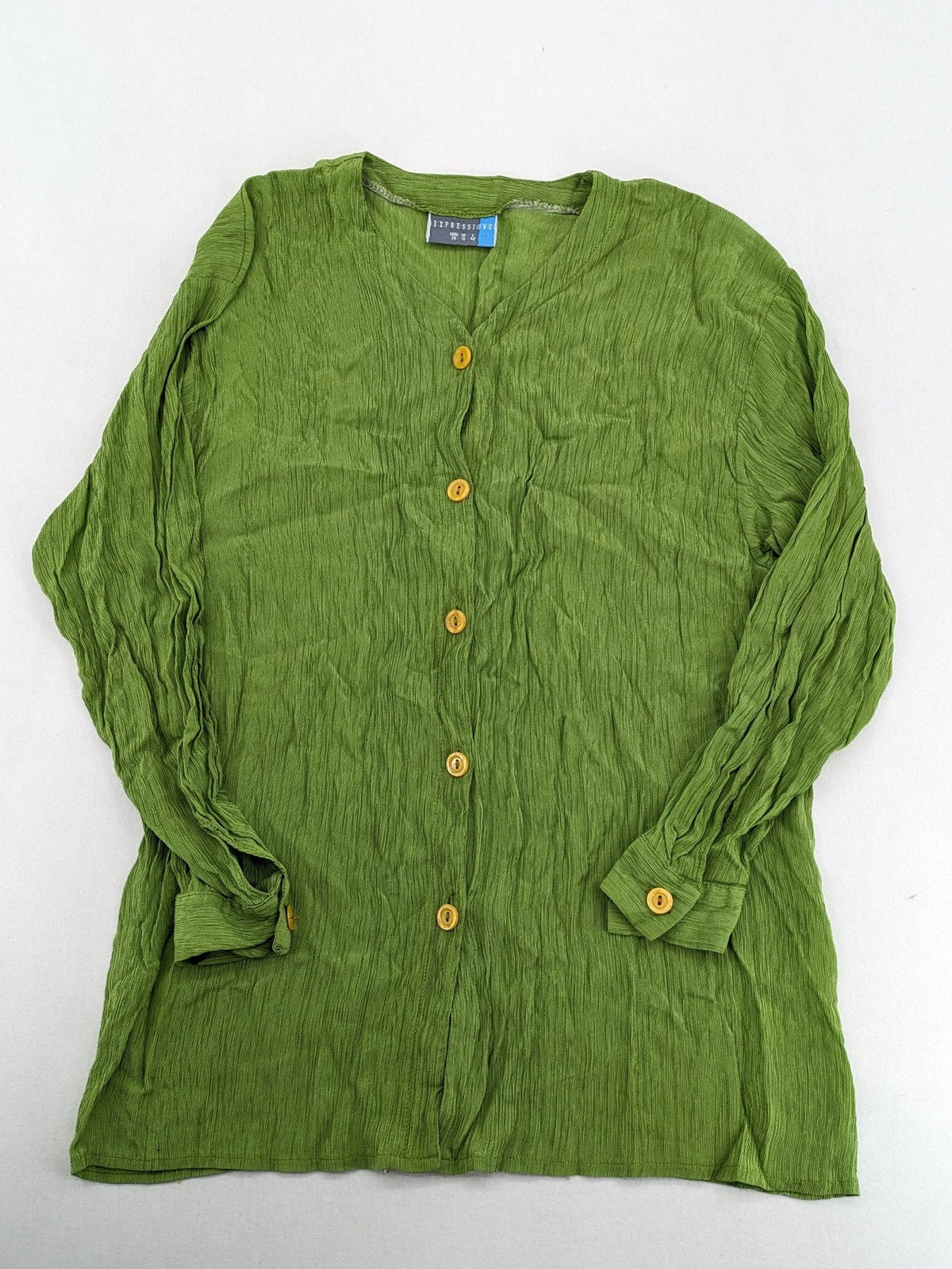 Expressions green blouse with V-neck, button front, and crinkle texture.