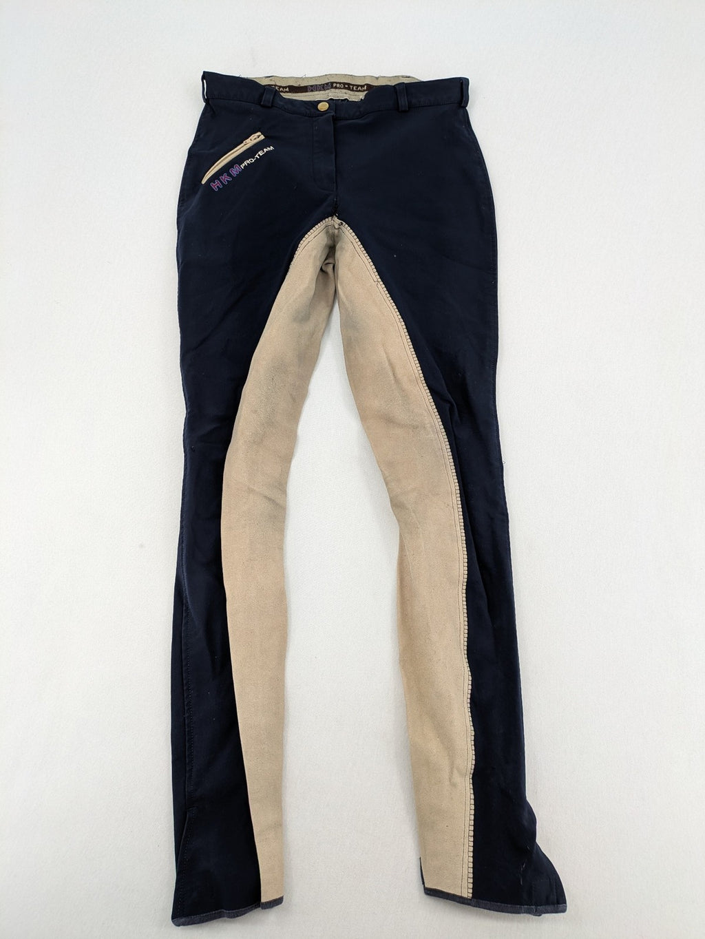 H&KM beige riding pants with dark blue full seat and front zippers.