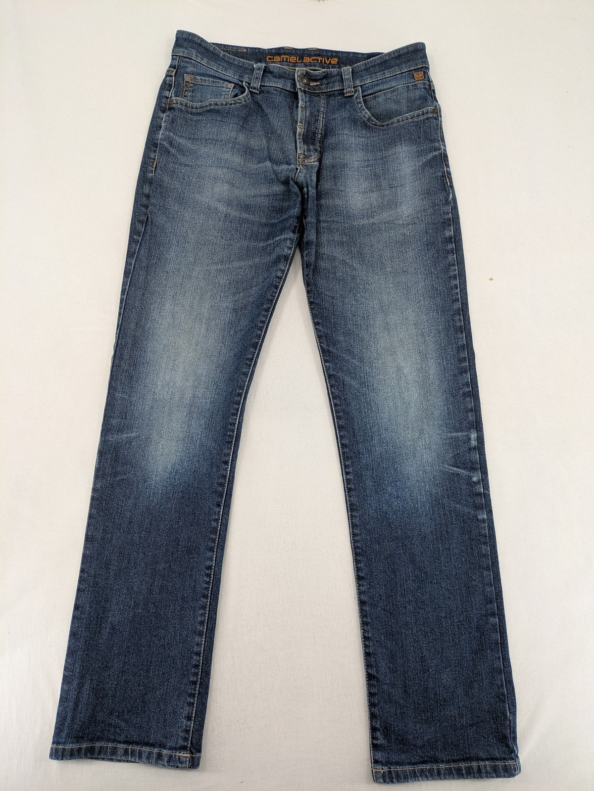 Camel Active blue straight jeans with classic 5-pocket design and logo patch.